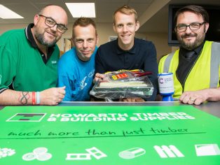 Olympic swimmer Ross Davenport (second from right) joins Howarth Timber staff at Derby branch relaunch